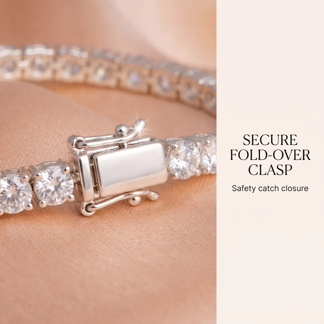 Macro detail shot of the tennis bracelet's fold-over safety clasp